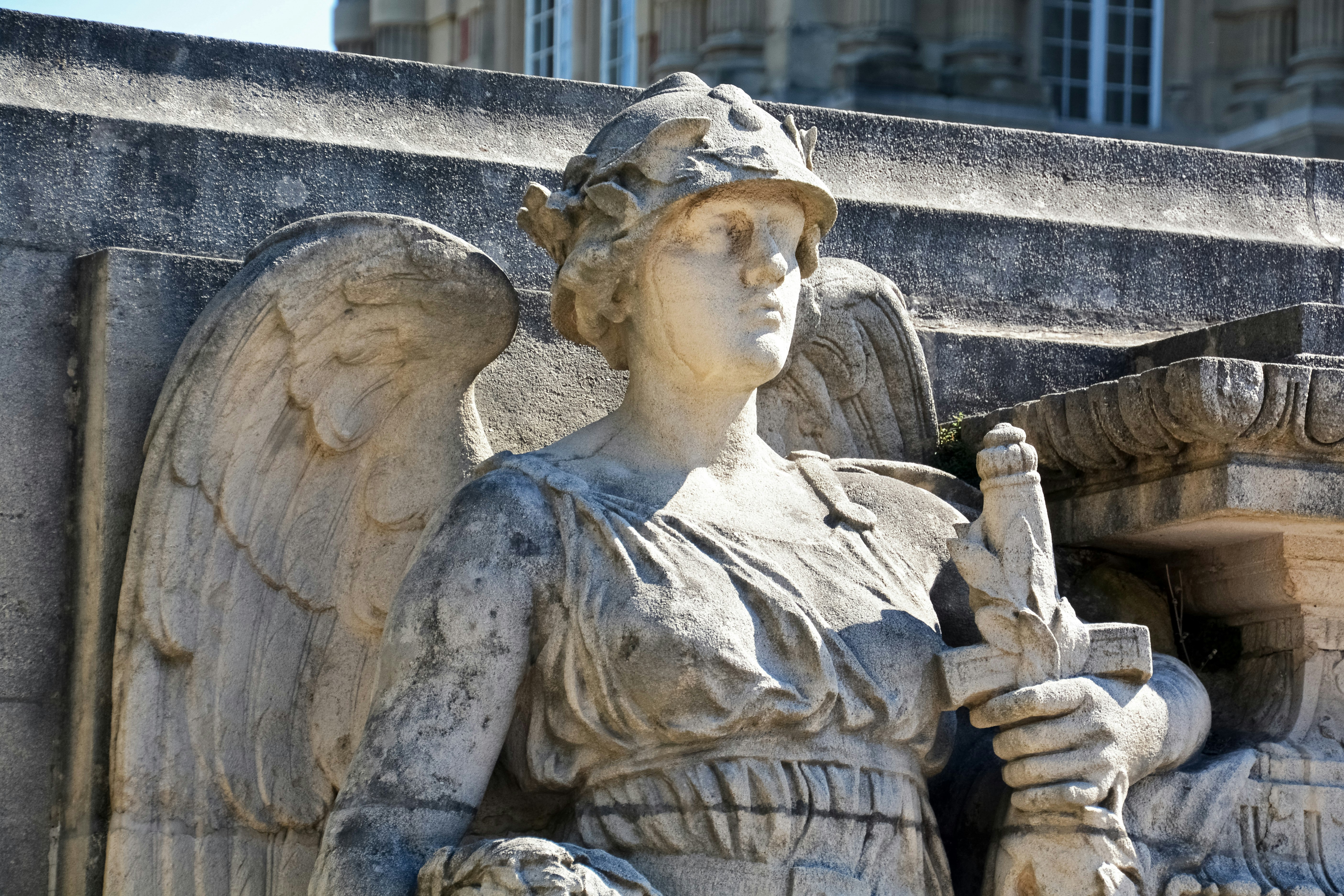 woman in dress statue during daytime